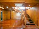 Wooden interior with staircase and polished floors