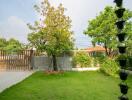 Backyard with fence and trees