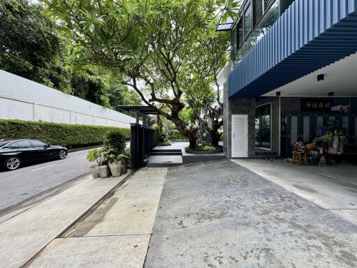 Exterior view of the property with driveway and garden