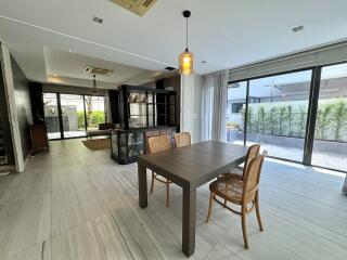 modern dining room with large windows and wooden table