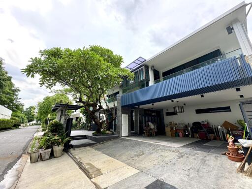 Modern two-story house with driveway and garden