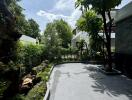 Spacious outdoor area with greenery and modern design