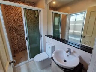 Modern bathroom with shower, toilet, and sink