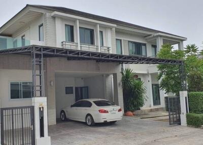 Two-story modern house with car parked in driveway