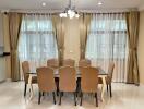 Dining room with chandelier and large windows