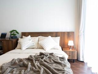 Cozy bedroom with wooden furniture and natural light