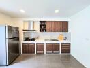 Modern kitchen with wooden cabinets and stainless steel appliances