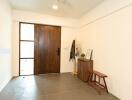 Entryway with wooden door and minimal decor