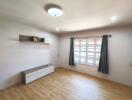 Minimalist living room with wooden flooring