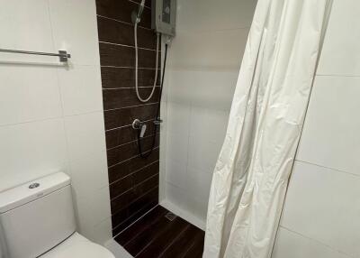 bathroom with shower and toilet