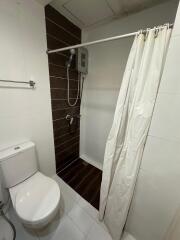 bathroom with shower and toilet