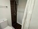 bathroom with shower and toilet