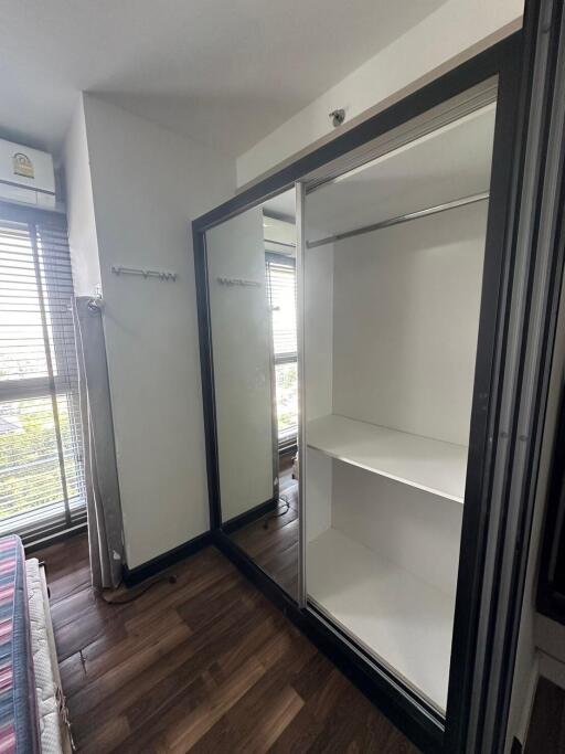 Bedroom with mirrored wardrobe and window