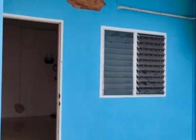 Blue exterior wall with door and window