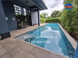 Outdoor swimming pool in building complex