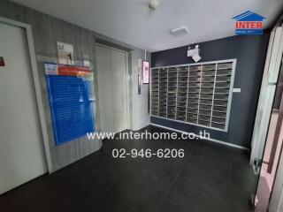 Lobby area with mailboxes and elevator access