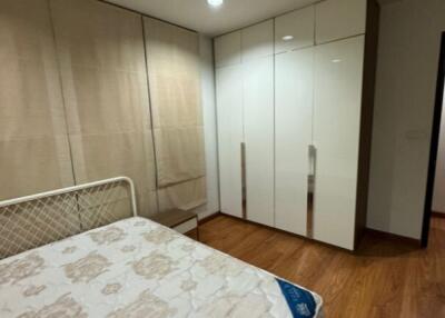 Bedroom with bed and built-in wardrobe