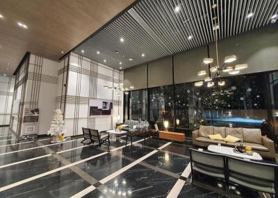 Spacious and modern lobby area with seating and decorations