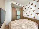 Modern bedroom with geometric patterned wall