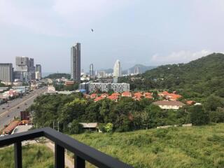 View from the balcony overlooking the city and greenery