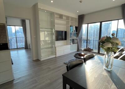 Modern living room with large windows and city view