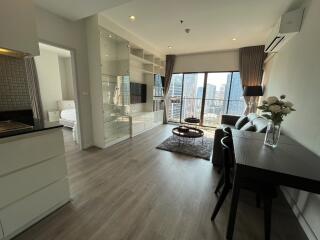 Modern living room with large windows and city view