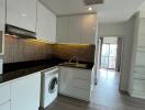 Modern kitchen with integrated appliances and wooden flooring