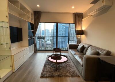 Modern living room with large windows and city view