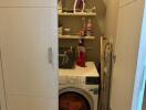 Compact laundry nook with washing machine and storage shelves