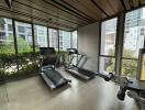 Well-equipped gym with treadmills and exercise machines