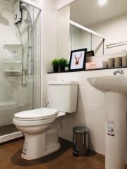 Modern bathroom with shower, toilet, and sink