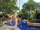 Beautiful swimming pool surrounded by lush greenery