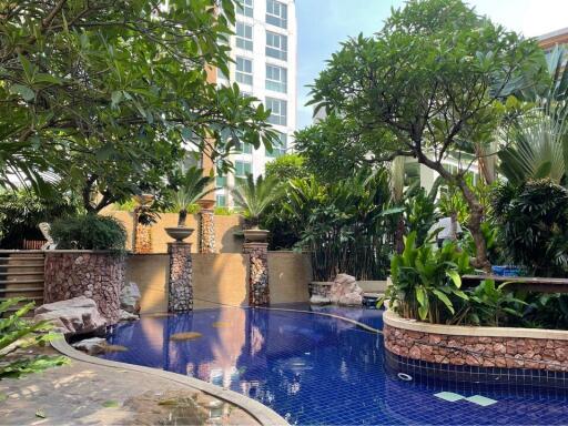 Beautiful swimming pool surrounded by lush greenery