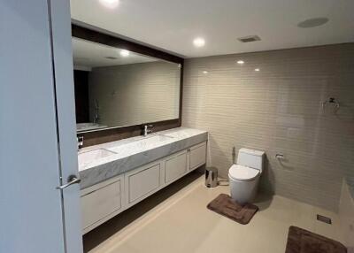 Modern bathroom with double sink and large mirror