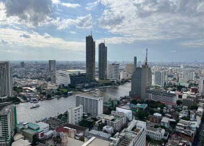 City view with tall buildings and a river