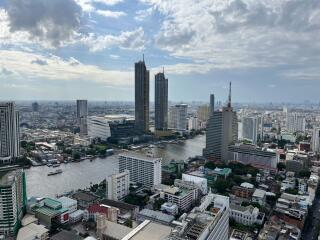 City view with tall buildings and a river