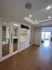 Spacious bedroom with built-in wardrobes and ceiling lights