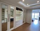 Spacious bedroom with built-in wardrobes and ceiling lights