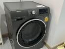 A washing machine in a laundry room