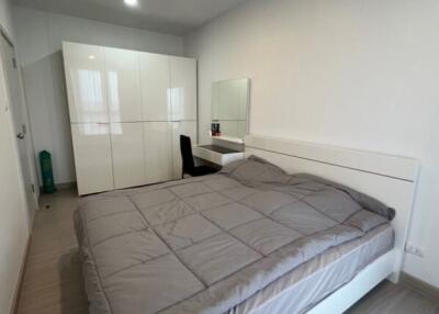 Modern bedroom with a double bed and a large wardrobe