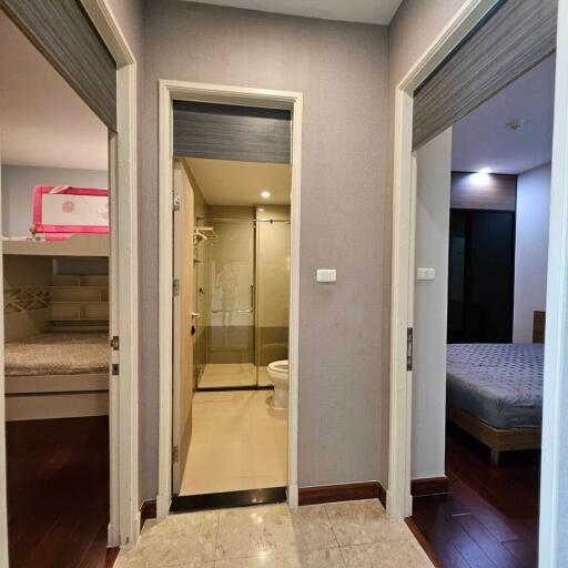 Hallway with access to bedrooms and bathroom