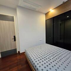 Modern bedroom with wooden floor and bed