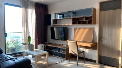 Modern living room with entertainment unit and natural light