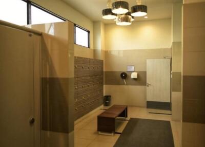 Modern locker room with ample lighting and seating
