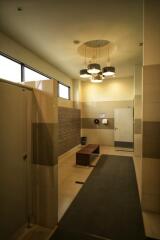 Modern locker room with ample lighting and seating