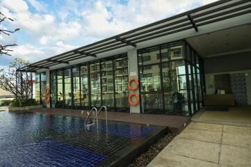 Modern building with pool and outdoor seating