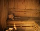 Wooden sauna interior with bench and sauna stones