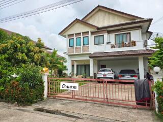 Front view of a house with a gated driveway