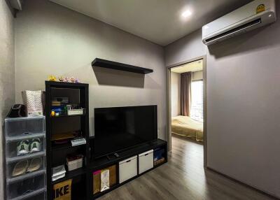 Modern living room with TV and storage shelves