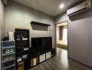 Modern living room with TV and storage shelves